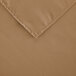 A beige Intedge square cloth table cover with a hemmed edge.