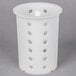 A white plastic Metro flatware cylinder with holes.