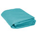 A folded teal polyester table cover.