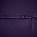 A close up of a purple polyester table cover with a black hem.