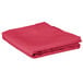 A folded hot pink table cover.