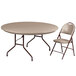 A tan plastic folding table and chair set with brown metal legs.