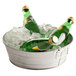 An American Metalcraft galvanized metal tub with ice holding green bottles.