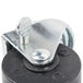 A Master-Bilt swivel stem caster with a black and white wheel and metal bolt.