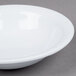 A white GET Centuria melamine bowl with a white rim on a gray surface.