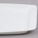 A white square Arcoroc tray with a white rim.