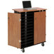 An Oklahoma Sound laptop charging station and storage cart with a laptop on top.