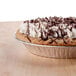 A chocolate pie with whipped cream on top in a D&W Fine Pack aluminum foil pie pan.
