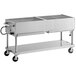 A large stainless steel grill on wheels with two shelves.