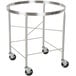 A stainless steel mobile mixing bowl stand with black wheels.