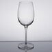A close-up of a Reserve by Libbey Renaissance wine glass on a reflective surface.