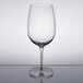 A Reserve by Libbey wine glass on a reflective surface.