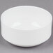 A 10 Strawberry Street white bone china bowl on a gray surface.
