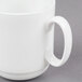 A close up of a 10 Strawberry Street white bone china espresso cup with a saucer.