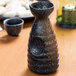 A black and white ceramic Whittier Nagoya sake bottle.