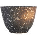A white speckled stoneware sake cup with black speckles.