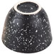 A white speckled stoneware sake cup with a black and white speckled bowl.