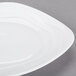 A white square porcelain side plate with a wavy design.