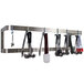 An Advance Tabco stainless steel wall mounted pot rack with kitchen utensils hanging from it.