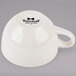 A white Tuxton Nevada china cup with a handle.