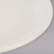 An ivory Tuxton Nevada china plate with a narrow rim.