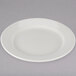 A Tuxton Reno ivory china plate with a wide rim on a white background.