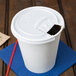 A Solo white plastic lid on a white paper cup.