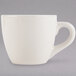 A Tuxton white china espresso cup with a handle.