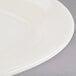 Tuxton TRE-012 Reno 10 1/2" x 7 3/8" Eggshell Wide Rim Oval China Platter - 24/Case Main Thumbnail 6