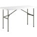 A Lancaster Table & Seating white rectangular table with metal legs.