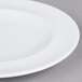 A close up of an Arcoroc Vintage brunch plate with a white rim.