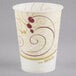 A white Solo paper cold cup with a red swirl design.