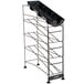 A black metal San Jamar Wireworks rack with three black trays on it.