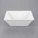 A white square bowl on a white background.