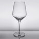 A close-up of a Reserve by Libbey Prism wine glass with a clear rim on a table.