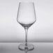 A close-up of a Reserve by Libbey Prism wine glass with a clear rim on a table.