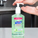 A close-up of a Purell Advanced Hand Sanitizer bottle on a counter.