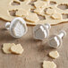 A white Ateco cookie cutter set with leaf designs.