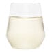 A close up of a WNA Comet clear plastic stemless wine goblet filled with white wine.