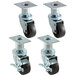 A set of four Pitco swivel casters with black rubber wheels.