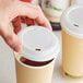 EcoChoice Translucent Compostable Paper Hot Cup Lid for 10-24 oz. Standard Cups and 8 oz. Squat Cups - 50/Pack Main Thumbnail 1