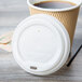 EcoChoice Translucent Compostable Paper Hot Cup Lid for 10-24 oz. Standard Cups and 8 oz. Squat Cups - 1000/Case Main Thumbnail 4