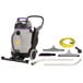 A ProTeam wet/dry vacuum with hose and tools.