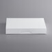 A white rectangular box on a gray surface.
