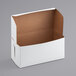 A white bakery box with a brown lid.