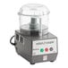A grey Robot Coupe food processor with a clear lid.