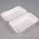 Two white Genpak foam hinged lid containers.