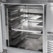 A Continental Refrigerator stainless steel worktop refrigerator with trays inside.