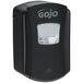 A black GOJO® touchless soap dispenser with a clear plastic window.