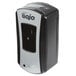 A close-up of a black and silver GOJO® touchless hand soap dispenser.
